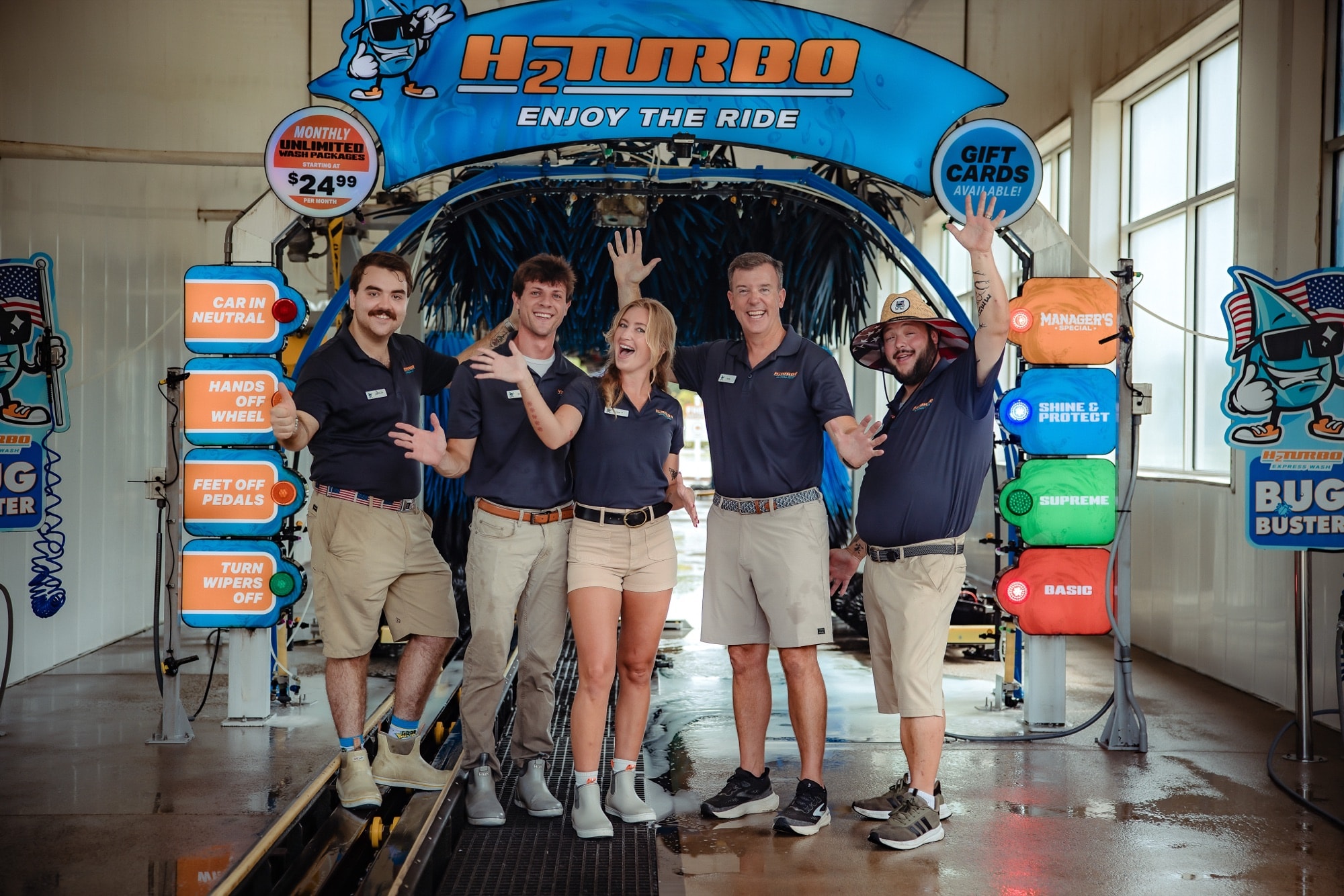 The H2Turbo crew in the wash tunnel with their hands in the air